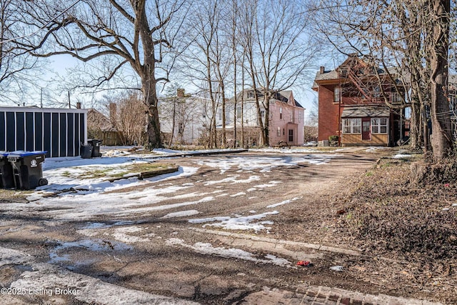 view of yard layered in snow