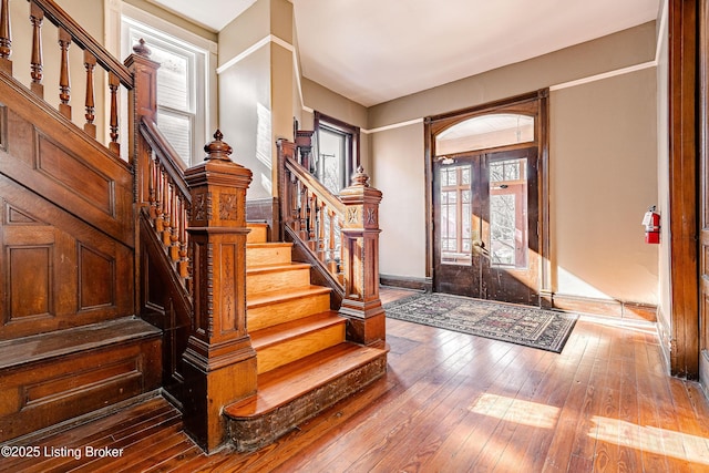 foyer with hardwood / wood-style flooring and french doors