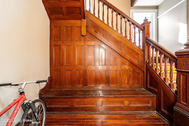 stairway featuring hardwood / wood-style floors