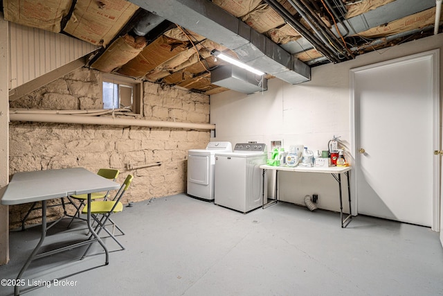 laundry area with independent washer and dryer