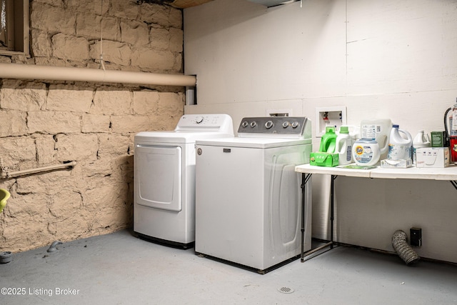 washroom with washer and dryer