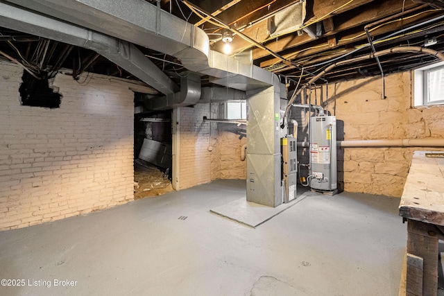 basement featuring gas water heater and heating unit