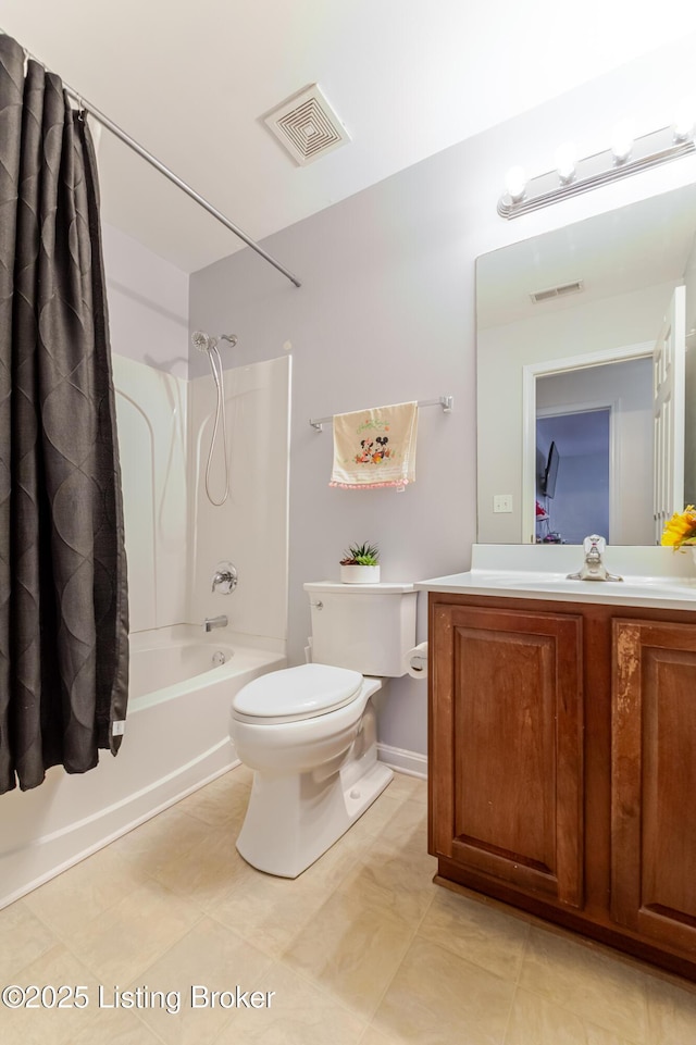 full bathroom featuring tile patterned floors, vanity, toilet, and shower / bath combo with shower curtain