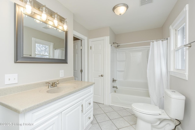 full bathroom with tile patterned flooring, vanity, plenty of natural light, and shower / bath combo