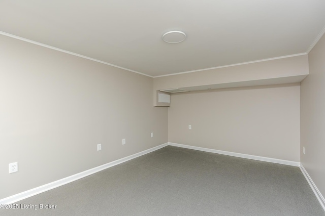 carpeted empty room featuring crown molding