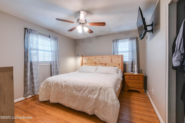 bedroom featuring hardwood / wood-style floors and ceiling fan