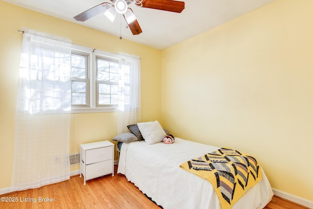 bedroom featuring ceiling fan and light wood-type flooring