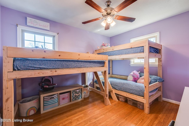 bedroom featuring hardwood / wood-style floors and ceiling fan