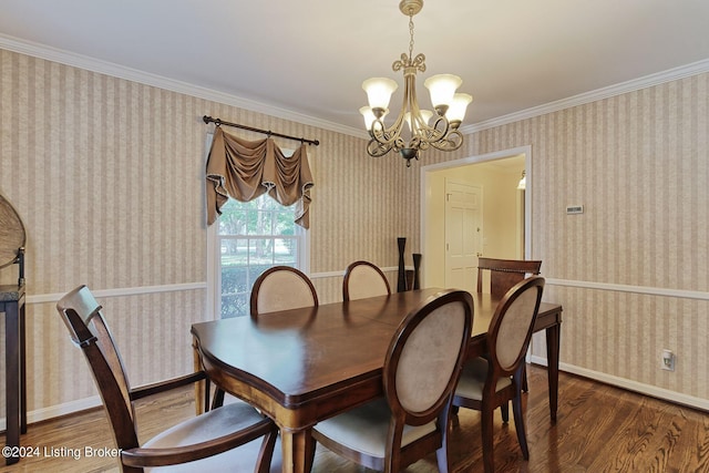 dining area with an inviting chandelier, ornamental molding, and wood-type flooring