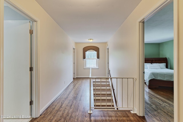 corridor with dark wood-type flooring