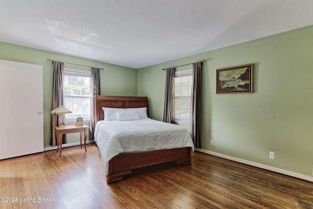 bedroom featuring dark wood-type flooring