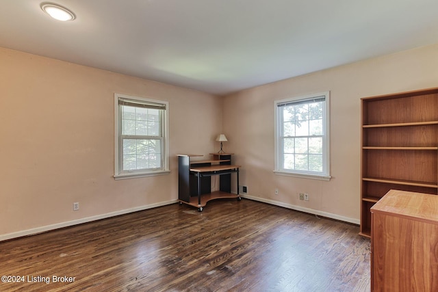 unfurnished office featuring dark wood-type flooring