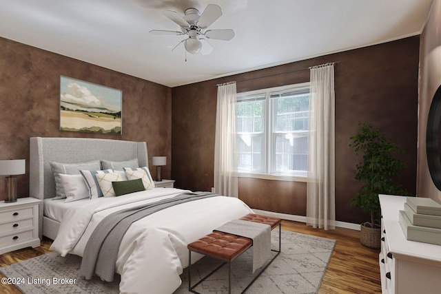 bedroom with hardwood / wood-style flooring and ceiling fan