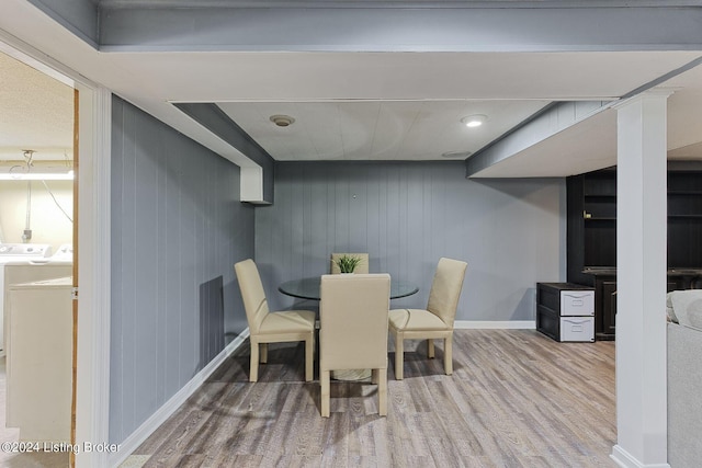 dining room featuring wood-type flooring and washer and dryer