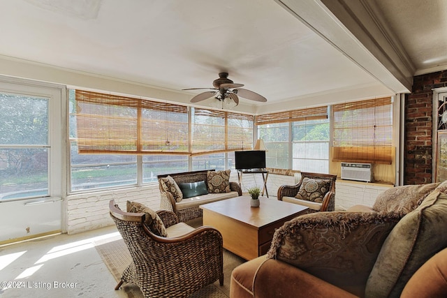 sunroom featuring cooling unit and ceiling fan