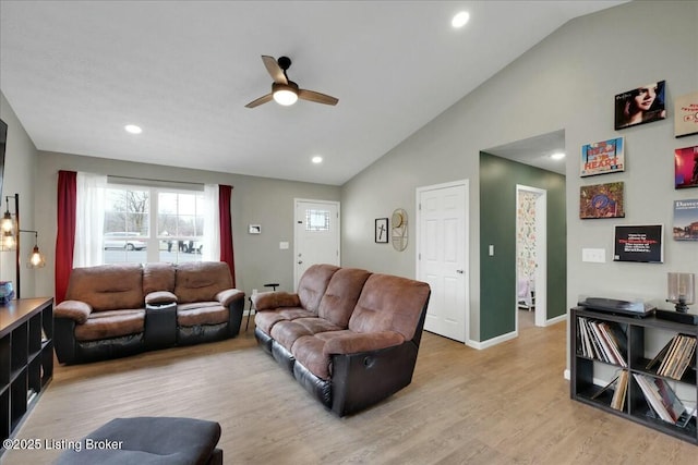 living room with high vaulted ceiling, light hardwood / wood-style floors, and ceiling fan