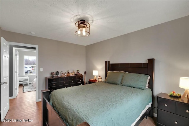 bedroom with light hardwood / wood-style flooring