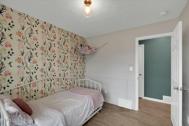 bedroom featuring hardwood / wood-style flooring