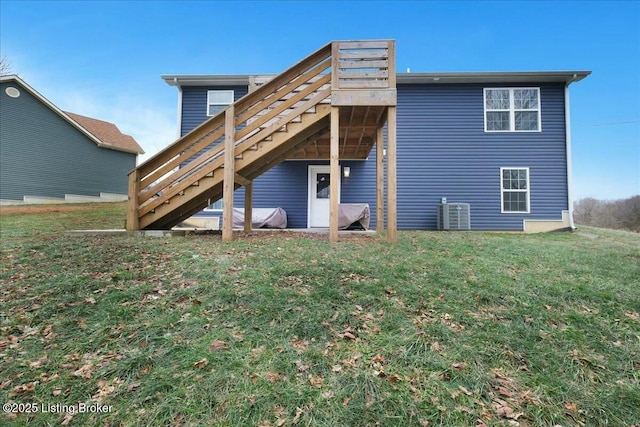 rear view of house featuring a yard