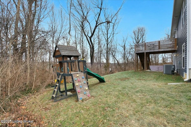 view of yard with a playground and central air condition unit