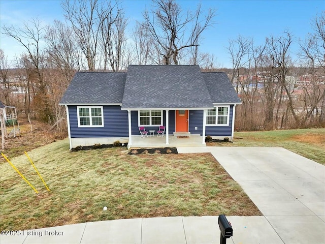 ranch-style home featuring a front yard and covered porch