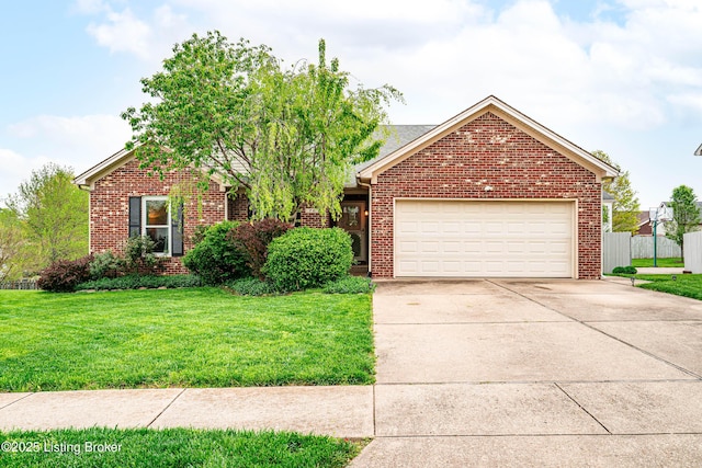 view of front of home with a garage and a front lawn