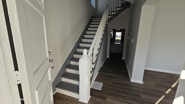 stairs featuring wood-type flooring