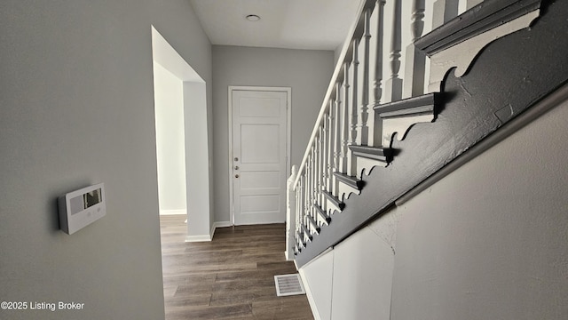 stairs with wood-type flooring