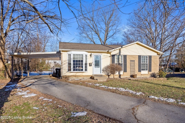 single story home with a carport and a front yard