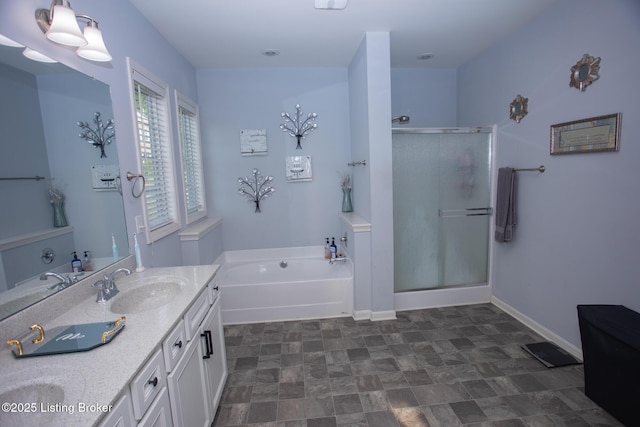 bathroom with vanity and independent shower and bath