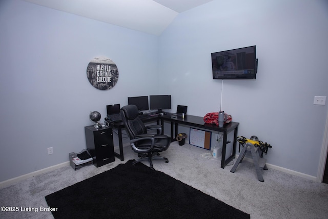 carpeted office with vaulted ceiling