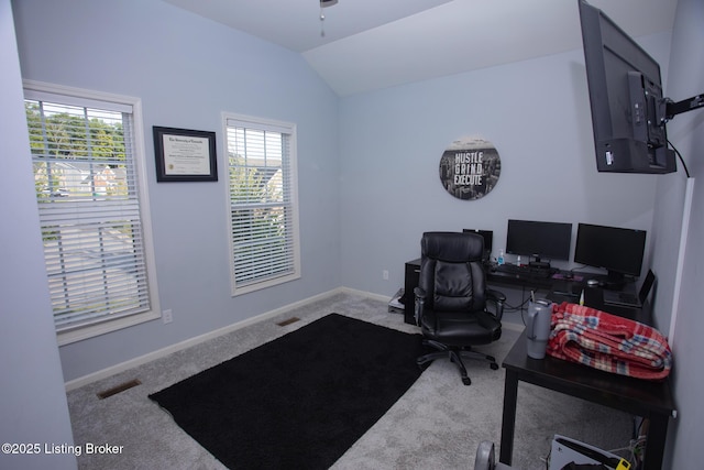 home office featuring carpet and lofted ceiling