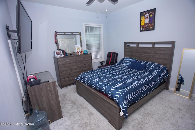 bedroom with light carpet and ceiling fan