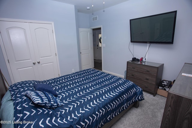 bedroom with a closet and carpet