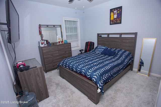 bedroom with light colored carpet and ceiling fan