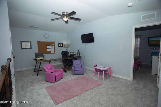 home office featuring light carpet, lofted ceiling, and ceiling fan