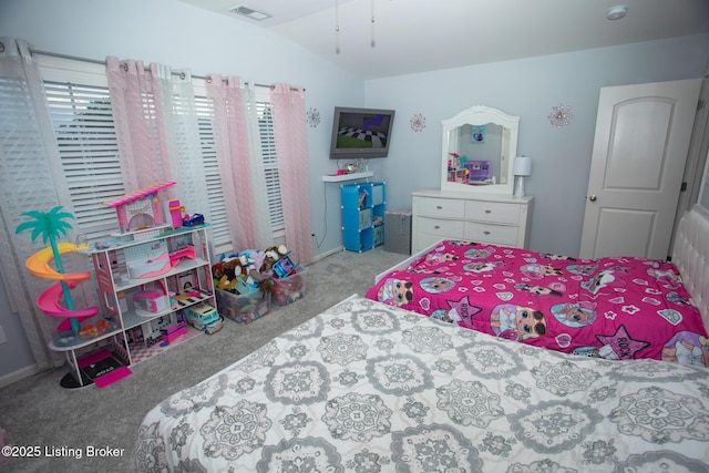 bedroom featuring vaulted ceiling and light colored carpet