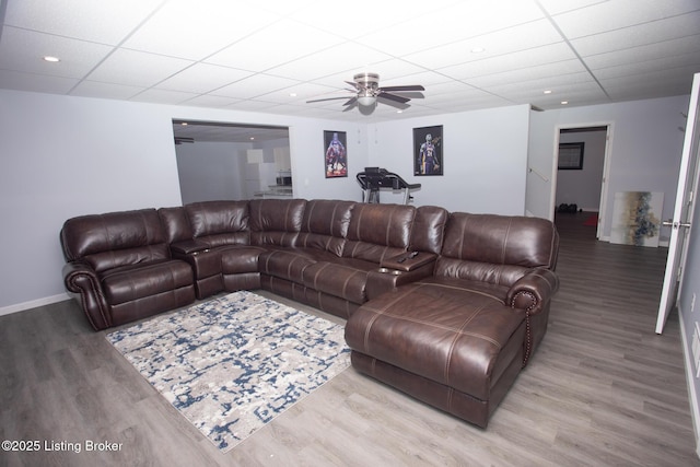 living room featuring ceiling fan and light wood-type flooring