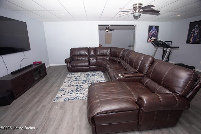 living room with ceiling fan and wood-type flooring