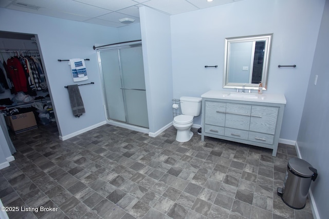 bathroom featuring vanity, toilet, and walk in shower