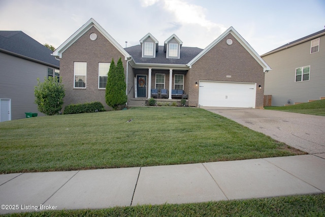 view of front of home featuring a garage, a front yard, and a porch