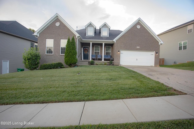 view of front of house with a garage, a front lawn, and a porch