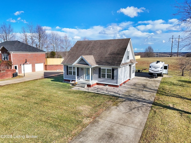 view of front of property with a garage, covered porch, and a front yard