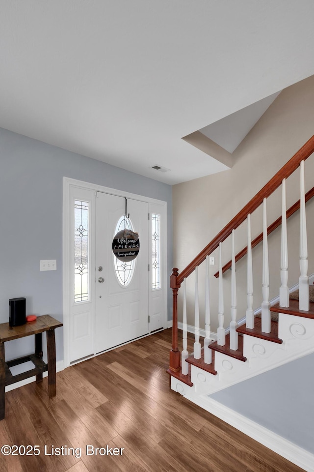 foyer entrance featuring hardwood / wood-style floors