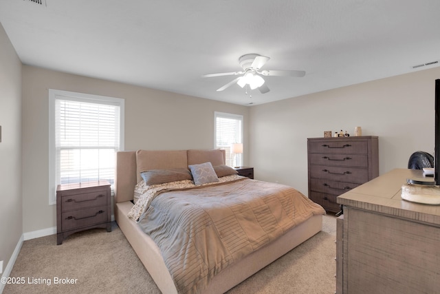 bedroom with light colored carpet and ceiling fan