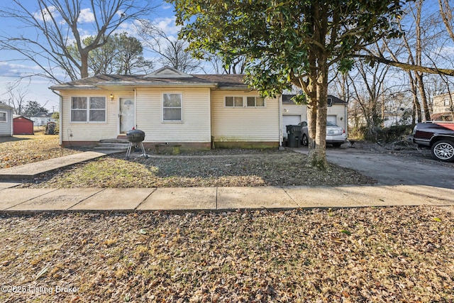 single story home featuring a garage