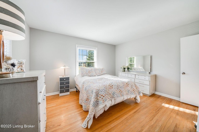 bedroom with light hardwood / wood-style floors