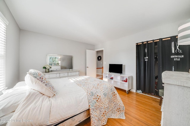 bedroom with light wood-type flooring