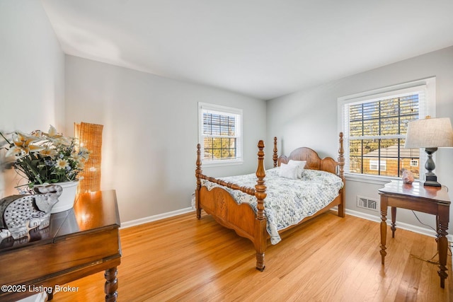 bedroom with light wood-type flooring