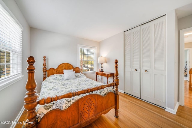 bedroom featuring light hardwood / wood-style floors and a closet